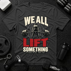 We All Lift Something T-Shirt